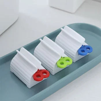 Lusta kézi fogkrém adagoló fürdőszoba kiegészítők arc tisztító kozmetikai nyomja készüléket ütés ingyenes klip tároló állvány